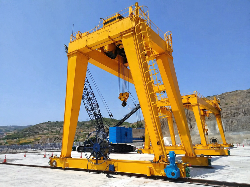 Image Alt: FEM Double Girder Gantry Crane with Open Winch for industrial yard lifting