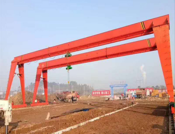 Two single girder gantry cranes at a construction site