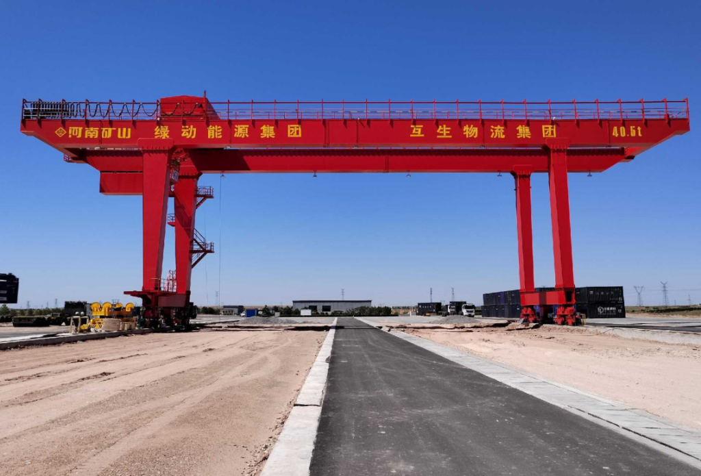 Rail-mounted yard gantry crane in a logistics yard